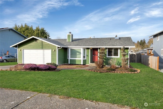 ranch-style home with a garage and a front lawn