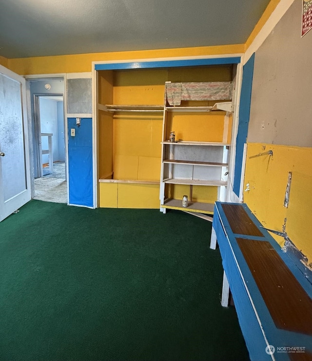 interior space featuring dark colored carpet