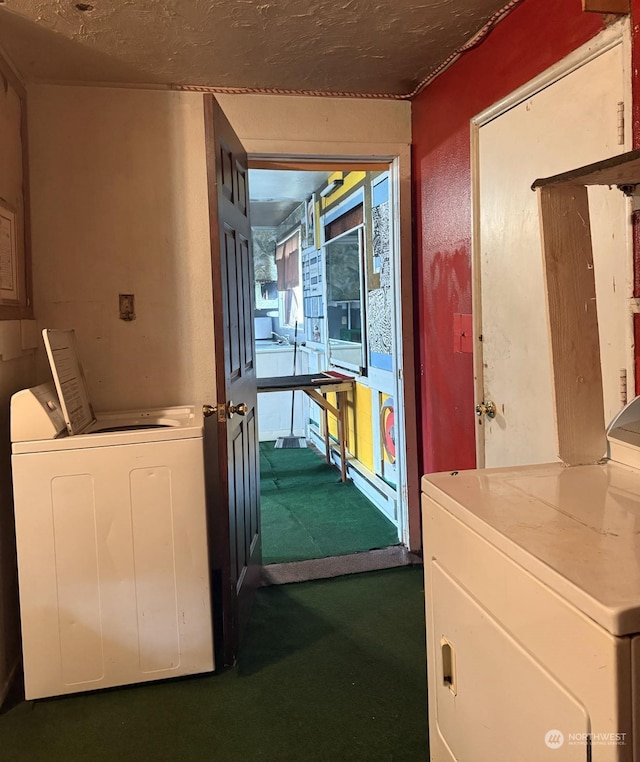 corridor featuring washing machine and dryer and a textured ceiling