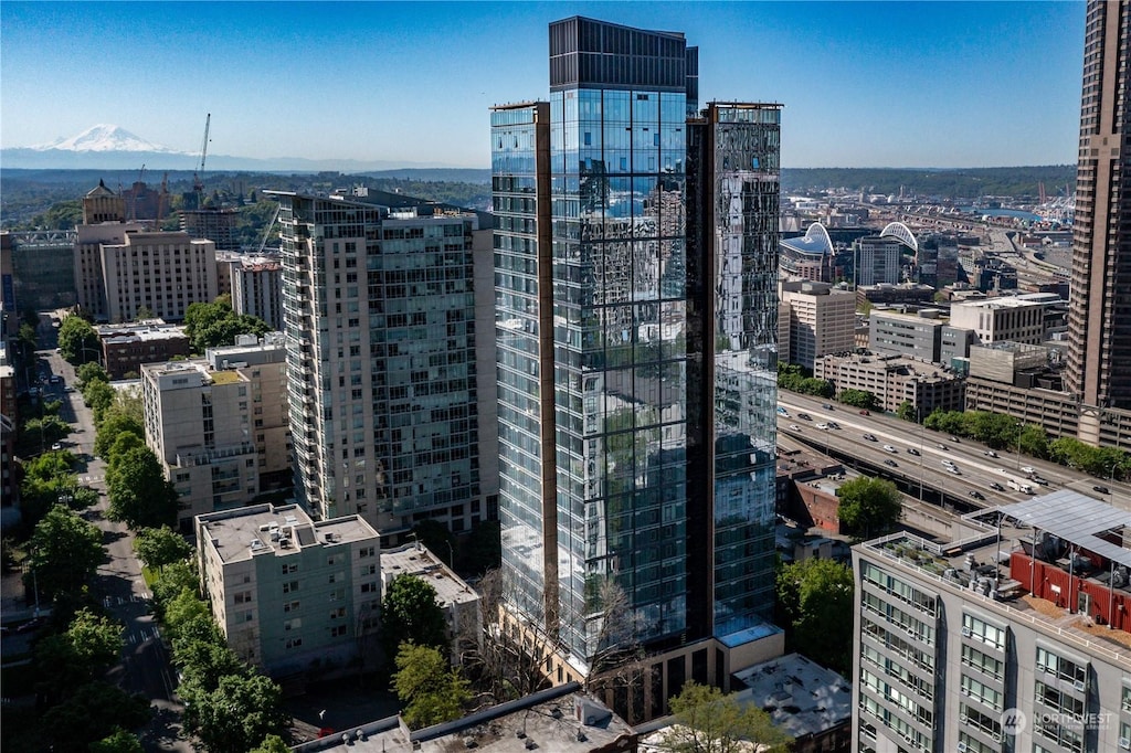 property's view of city with a mountain view