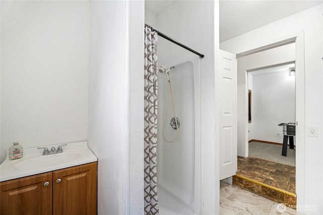 bathroom featuring vanity and curtained shower