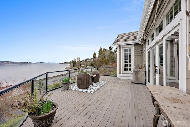 wooden terrace with a water view