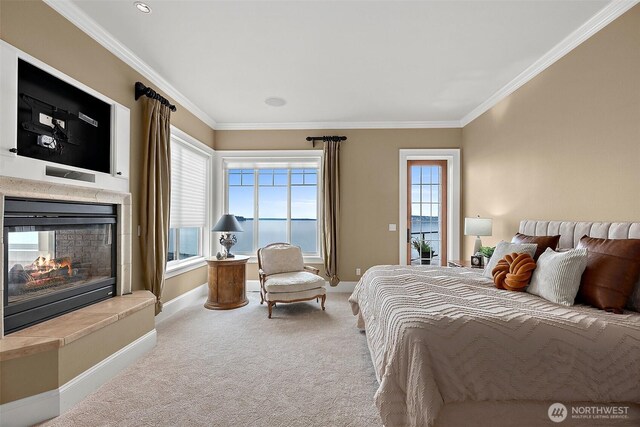 bedroom featuring crown molding, carpet flooring, baseboards, and a multi sided fireplace