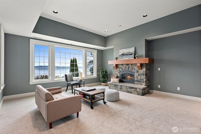 living area with carpet flooring, recessed lighting, a fireplace, and baseboards