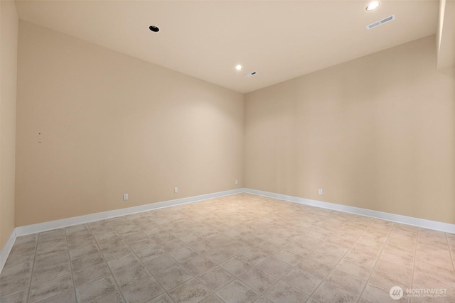 unfurnished room with recessed lighting, baseboards, and visible vents