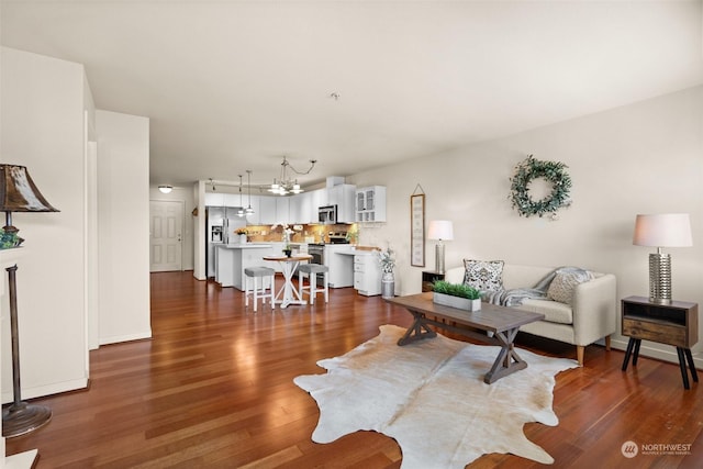 living room with dark hardwood / wood-style flooring