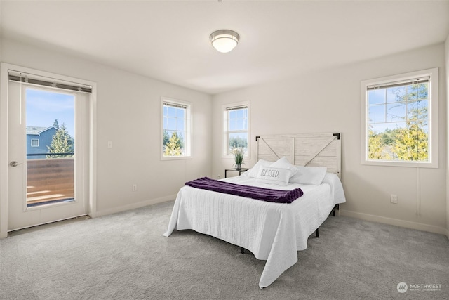 carpeted bedroom featuring access to exterior