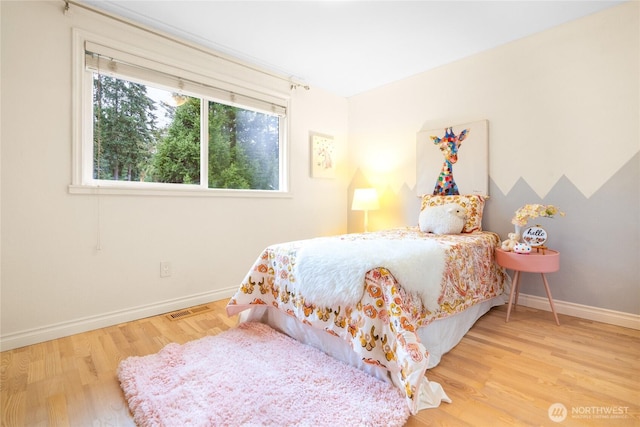 bedroom with light wood-type flooring