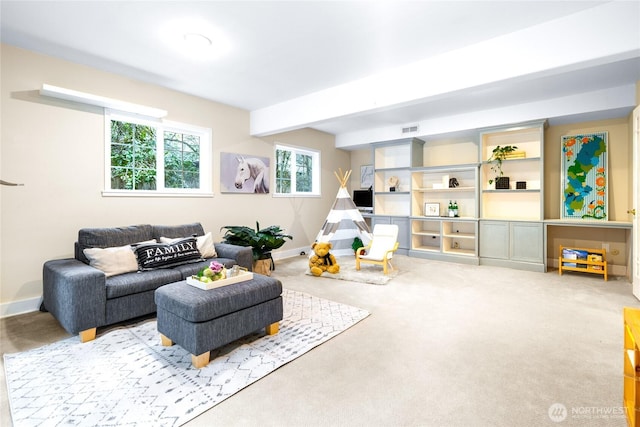 interior space with beamed ceiling and carpet floors