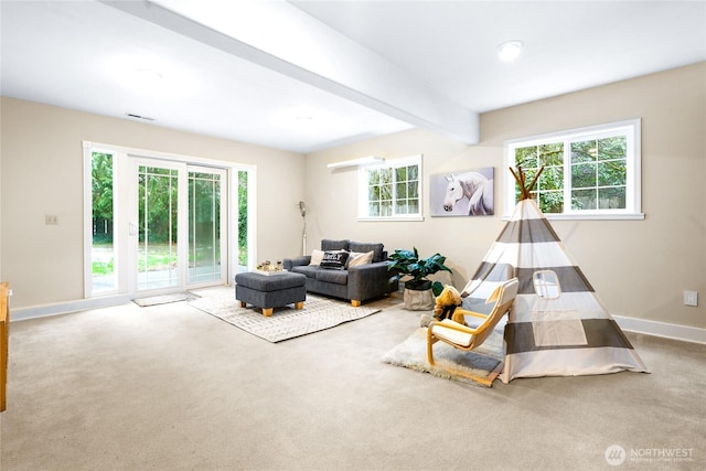 interior space featuring carpet floors and beamed ceiling