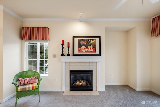 unfurnished room with a tiled fireplace, ornamental molding, and light carpet