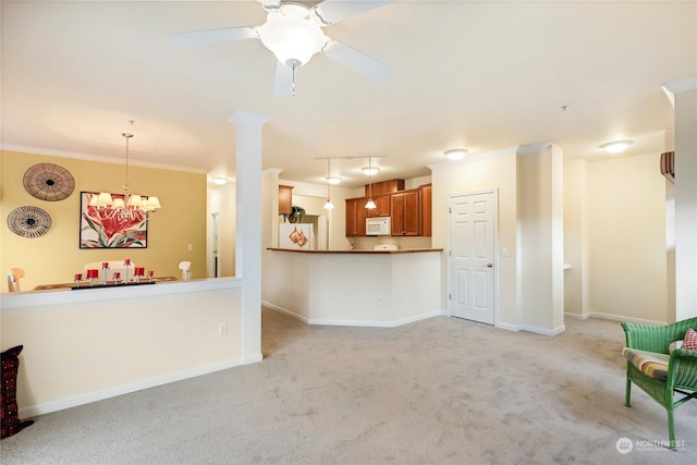 unfurnished living room with light colored carpet, ornamental molding, and ceiling fan with notable chandelier