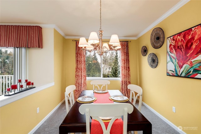 carpeted dining room featuring ornamental molding and a chandelier