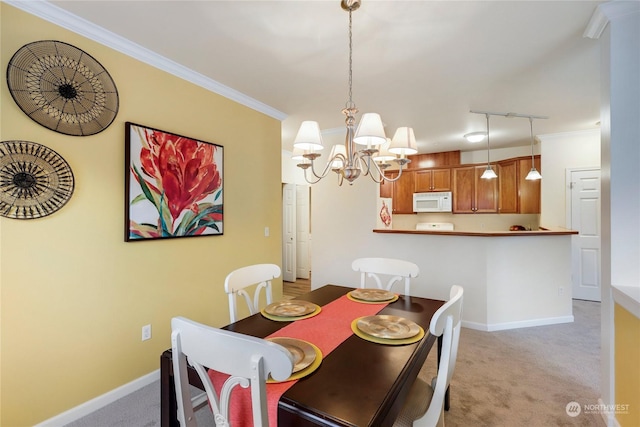 dining area featuring crown molding, light colored carpet, and a chandelier