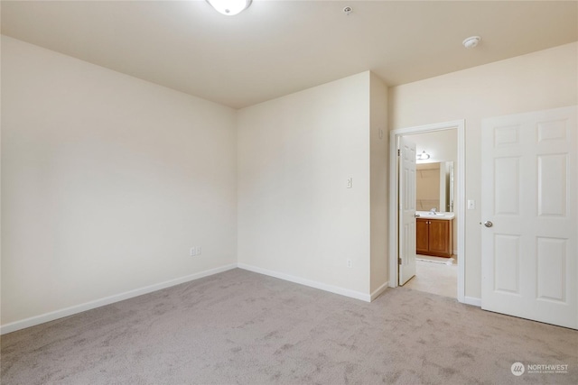 carpeted spare room featuring sink