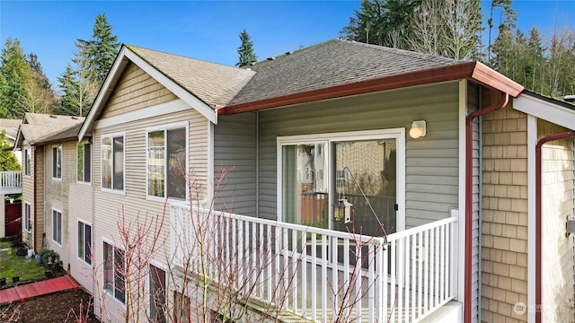 view of property exterior featuring covered porch