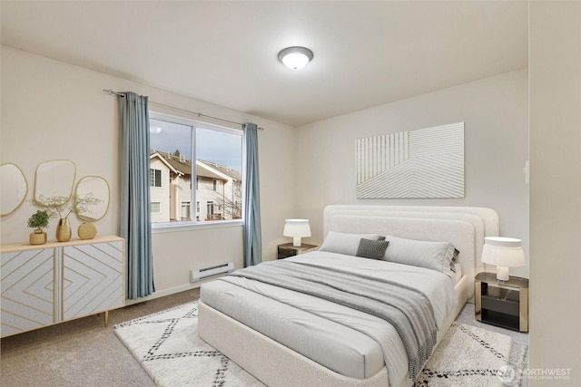 bedroom featuring light colored carpet and baseboard heating