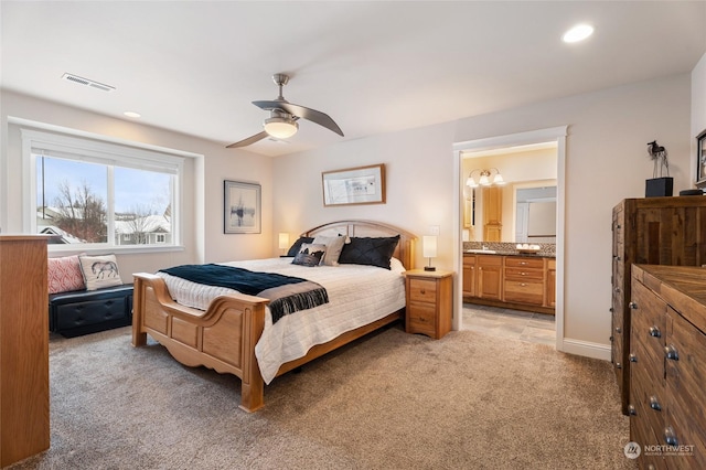 bedroom with visible vents, a ceiling fan, light colored carpet, ensuite bath, and recessed lighting