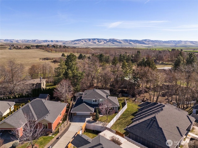 drone / aerial view featuring a residential view and a mountain view