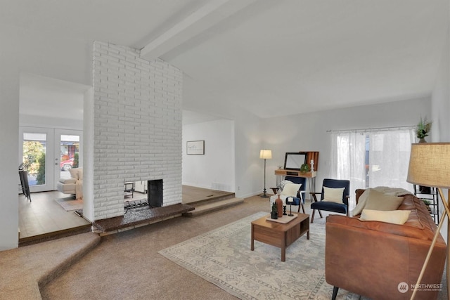 living room with lofted ceiling with beams, carpet flooring, a wealth of natural light, and a fireplace