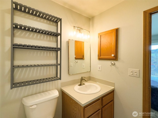 bathroom with vanity and toilet