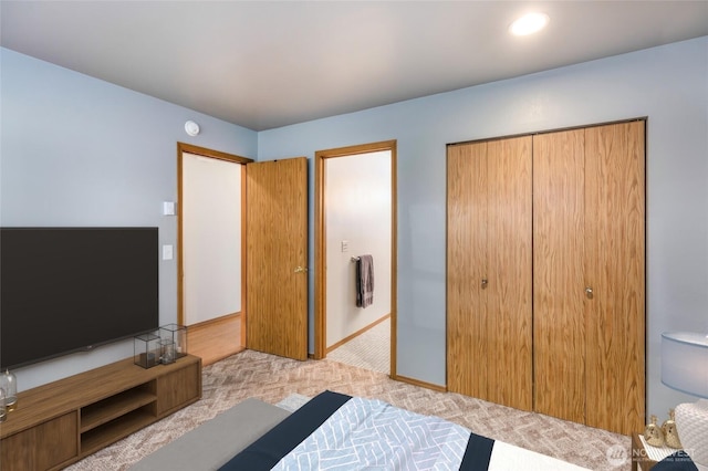 230 B St Unit 102, Friday Harbor, WA 98250 - bedroom featuring light carpet, a closet, and baseboards