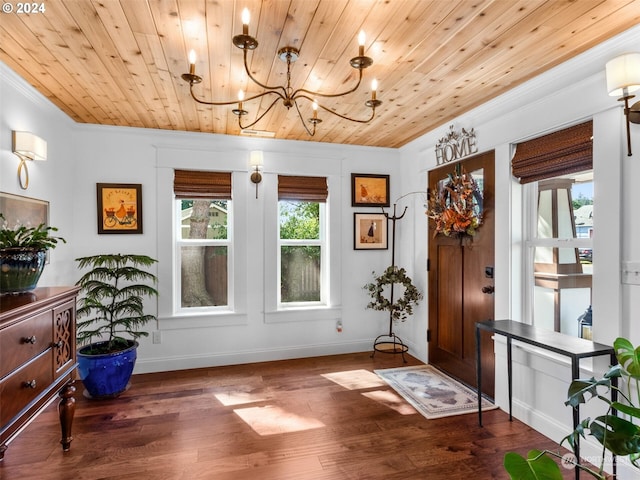 interior space featuring dark wood-type flooring, crown molding, a chandelier, and wooden ceiling