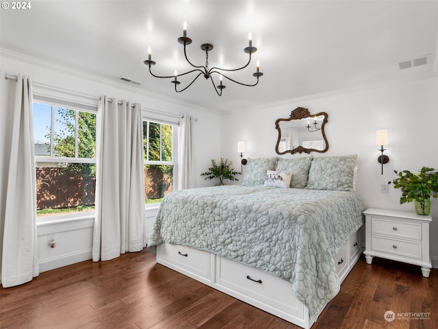 bedroom with ornamental molding, dark hardwood / wood-style floors, and a notable chandelier