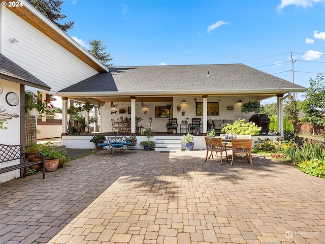 back of property with a patio