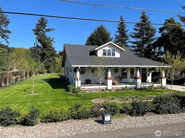 1638 N 2nd Ave, Kelso, WA 98626 - view of front of home featuring fence, a shingled roof, covered porch, and a front yard