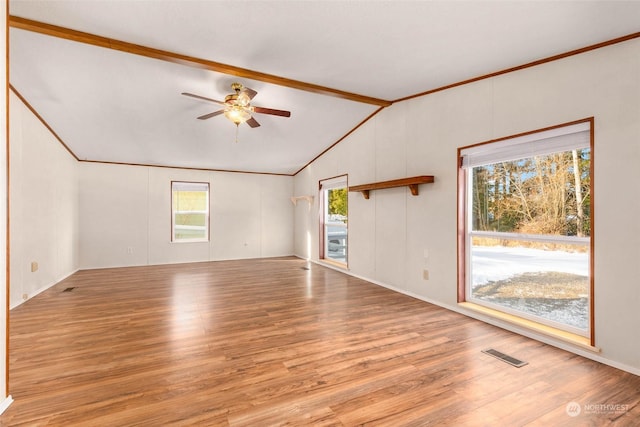 unfurnished living room featuring vaulted ceiling with beams, ornamental molding, ceiling fan, and light wood-type flooring