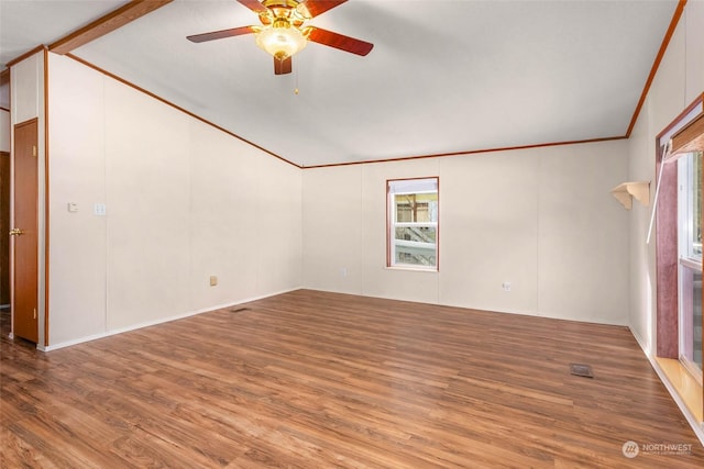 unfurnished room with lofted ceiling, wood-type flooring, ornamental molding, and ceiling fan