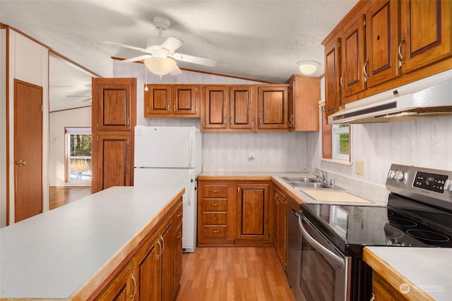 kitchen with lofted ceiling, electric range, white fridge, ceiling fan, and light hardwood / wood-style floors