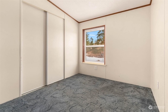 unfurnished bedroom featuring crown molding and carpet