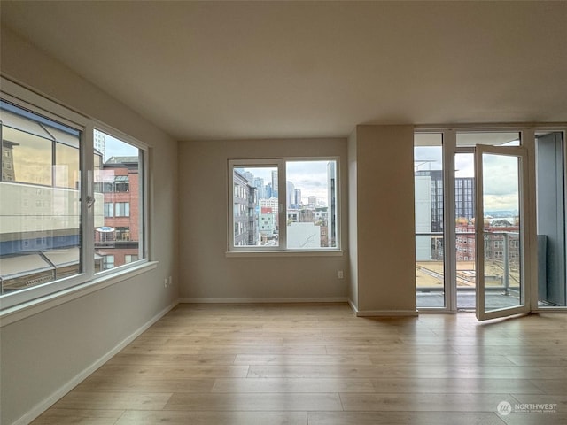 unfurnished room with light hardwood / wood-style floors