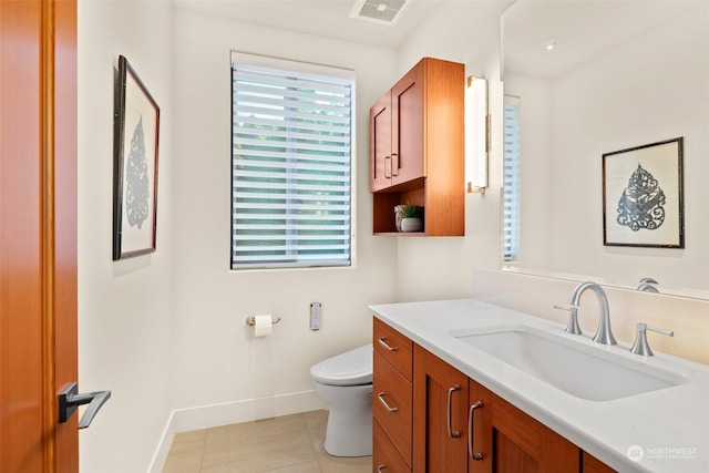 bathroom with vanity and toilet