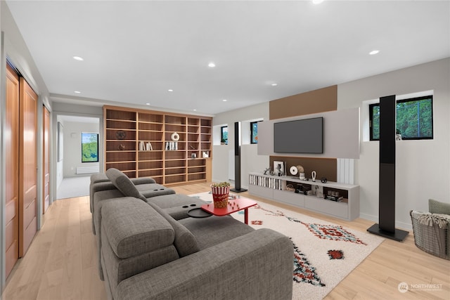 living room featuring a wealth of natural light and light wood-type flooring