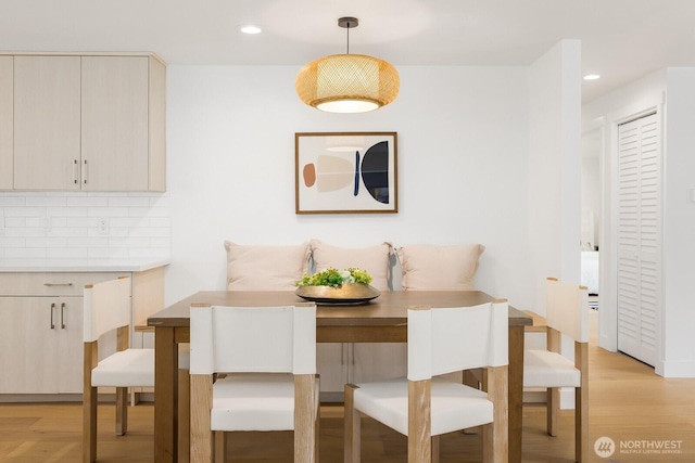 dining room featuring light wood finished floors and recessed lighting