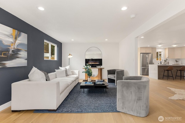 living room featuring recessed lighting and light wood-style floors