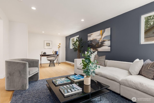 living area with recessed lighting, wood finished floors, and baseboards