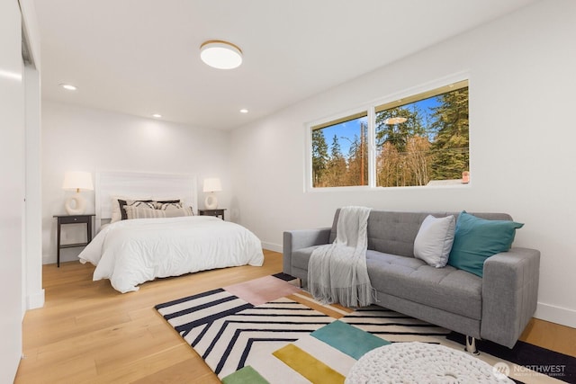 bedroom featuring recessed lighting, baseboards, and wood finished floors