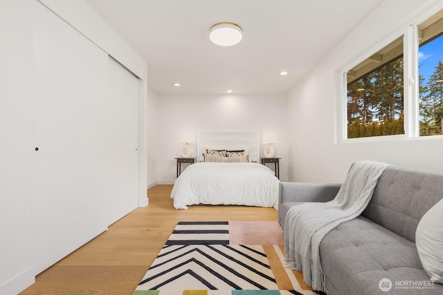 bedroom featuring light wood finished floors and recessed lighting