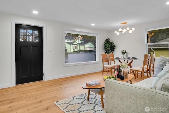 living room featuring hardwood / wood-style floors and a chandelier