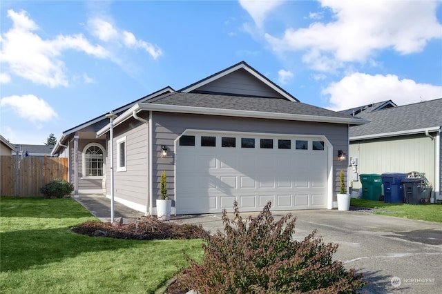 view of front facade featuring a garage and a front lawn