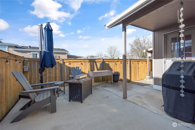 view of patio / terrace featuring a fire pit