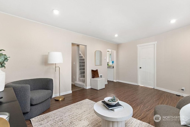 living room with dark hardwood / wood-style flooring