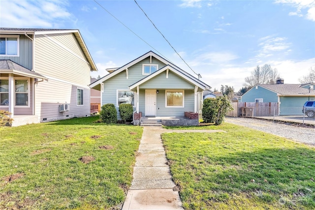 bungalow featuring a porch and a front yard