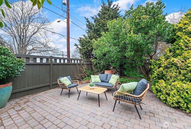 view of patio / terrace with an outdoor hangout area and a fenced backyard