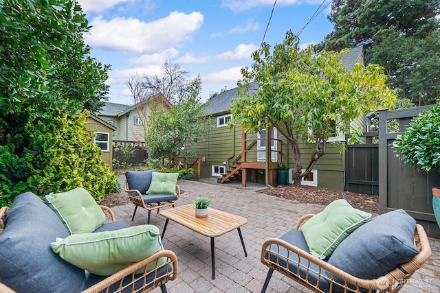 view of patio with fence and an outdoor hangout area