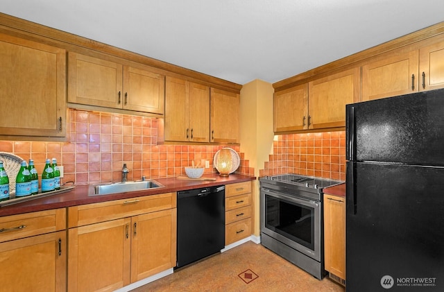 kitchen with decorative backsplash, dark countertops, brown cabinets, black appliances, and a sink